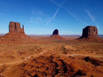 View of desert against blue sky