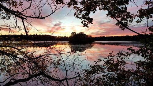 Scenic view of lake against sky during sunset