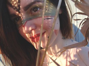 Close-up of young woman with face paint