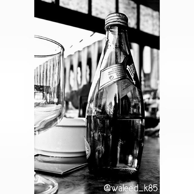 drink, glass - material, close-up, refreshment, focus on foreground, indoors, transparent, still life, food and drink, drinking glass, table, glass, bottle, alcohol, transfer print, reflection, auto post production filter, selective focus, no people, single object