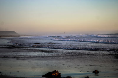 Scenic view of sea against sky during sunset