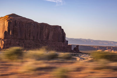 Rock formations on landscape against sky