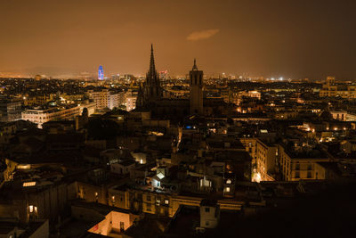 High angle view of city buildings at night