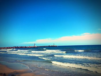 Scenic view of sea against blue sky