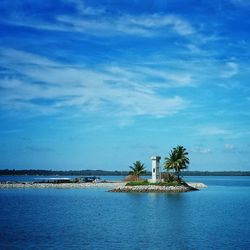 Scenic view of sea against cloudy sky