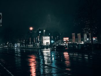 Illuminated city street at night