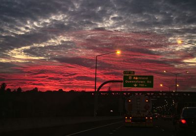 Road against cloudy sky at sunset