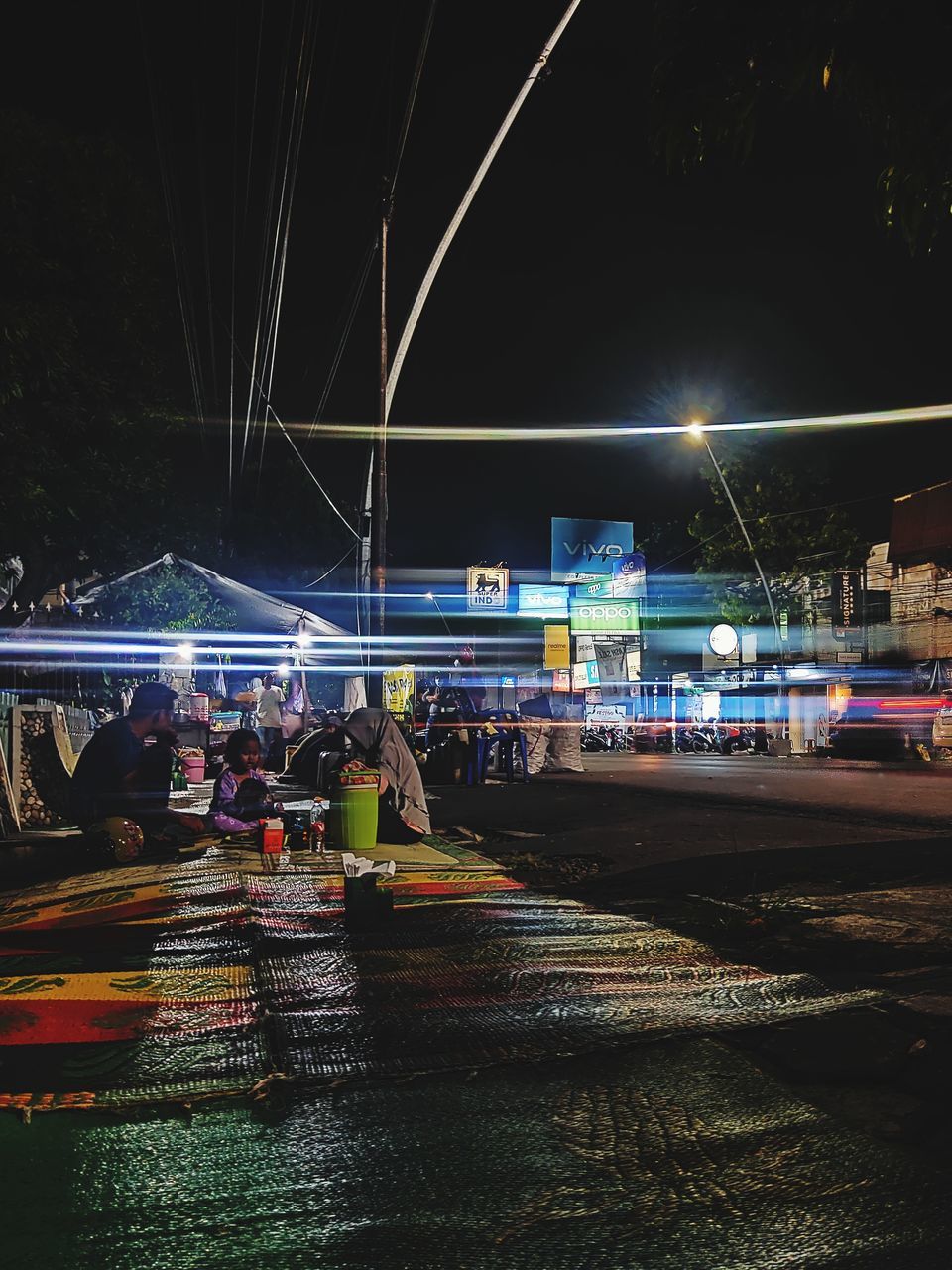 ILLUMINATED CITY STREET AT NIGHT