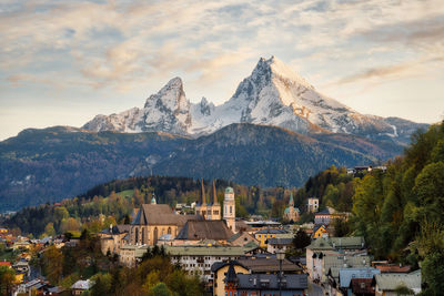 Panoramic view of buildings and mountains against sky