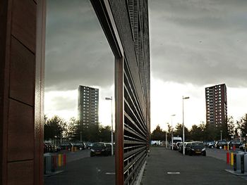 City street against cloudy sky