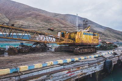 Maintenance machinery in the harbor of pyramiden, svalbard