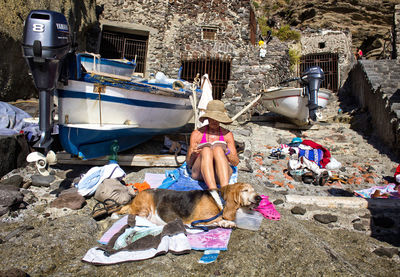 Dog on boats moored in front of building
