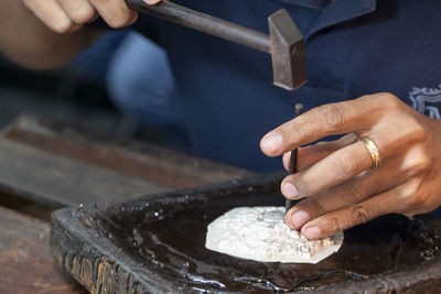 Midsection of person preparing food