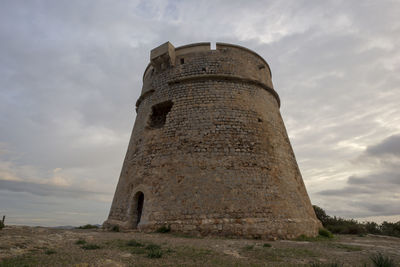 Low angle view of old building against sky