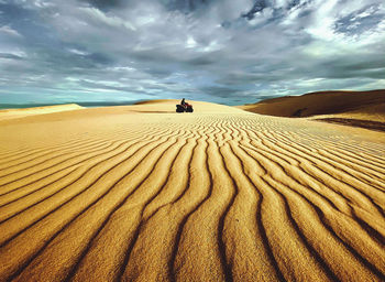 Scenic view of desert against sky