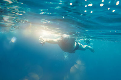 Man swimming in sea