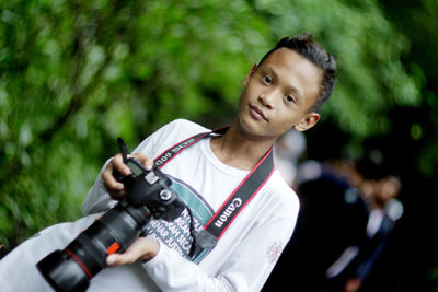 Portrait of young man photographing