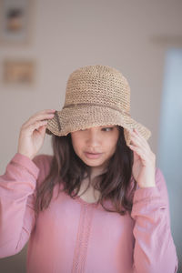 Portrait of cute girl wearing hat