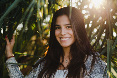 Portrait of smiling young woman outdoors