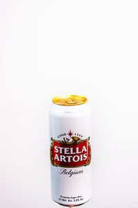 Close-up of glass bottle against white background