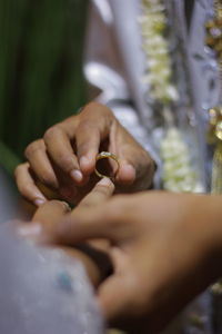 Close-up of woman holding hands