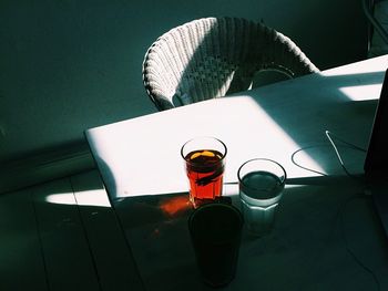 Close-up of wine glasses on table