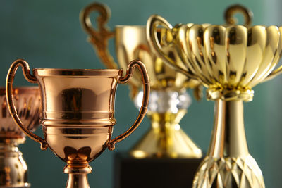 Close-up of trophy against green background