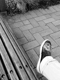 High angle view of woman standing on tiled floor