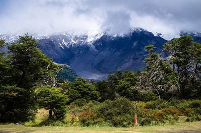 Scenic view of mountains against cloudy sky