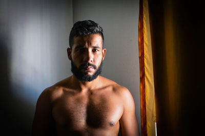 Portrait of young man looking at camera