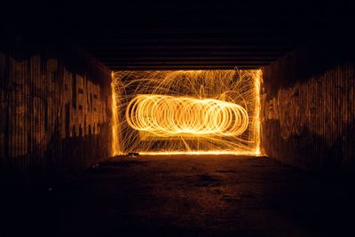 Light trails in illuminated tunnel