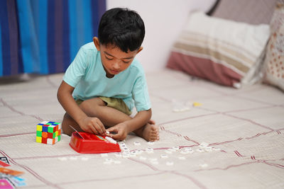 Boy drawing on paper