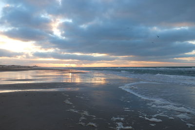 Scenic view of sea against sky at sunset