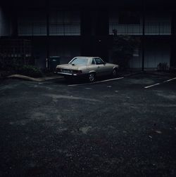 Cars parked on road in city