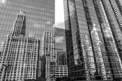 Low angle view of modern buildings against sky