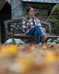 Young woman sitting on bench