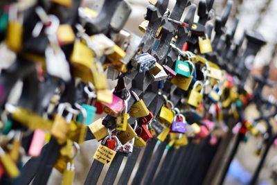 Close-up of love locks on bridge railing