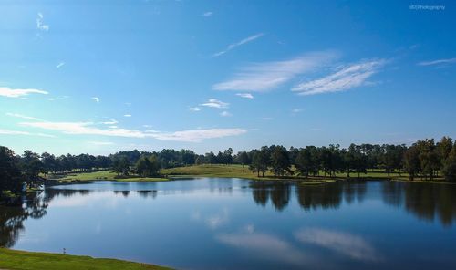 Scenic view of lake against blue sky