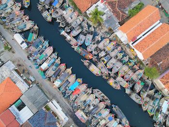 Beautiful aerial view of boats lined up in a fishing village, in cirebon, west java - indonesia.