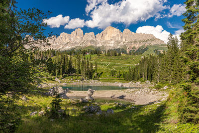 Lake carezza is a small alpine lake in the dolomites, italy.