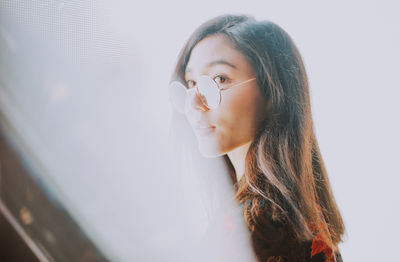 Portrait of young woman looking away