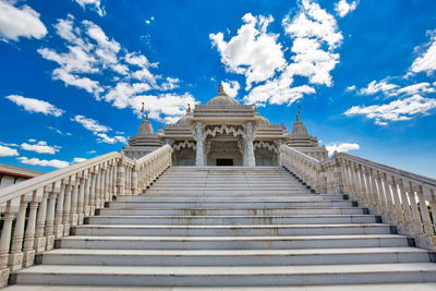 Low angle view of building against cloudy sky