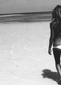 Woman standing on beach