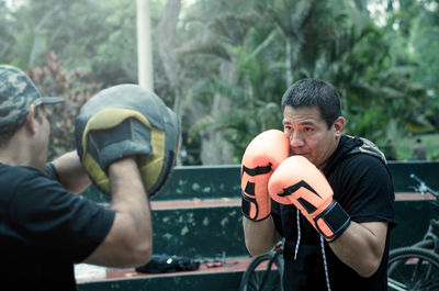 Man practicing boxing outdoors