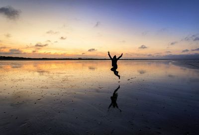 Scenic view of sea at sunset