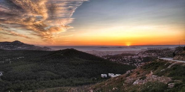 Scenic view of landscape against sky during sunset