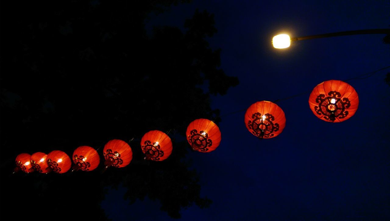 illuminated, night, lantern, red, low angle view, orange color, lighting equipment, celebration, chinese lantern, hanging, tradition, decoration, text, cultures, culture, clear sky, communication, traditional festival, dusk, copy space