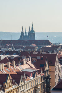 View of buildings in city against clear sky