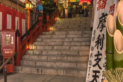 Illuminated staircase of building in city