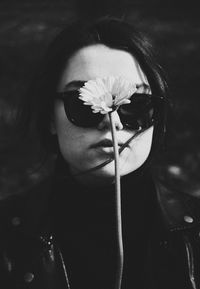 Close-up of woman holding flower